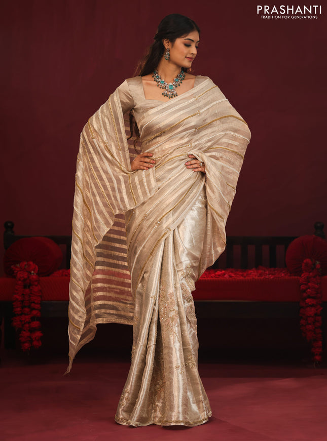 Tissue organza silk saree with allover stripes & embroidery