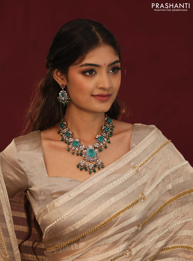 Tissue organza silk saree with allover stripes & embroidery