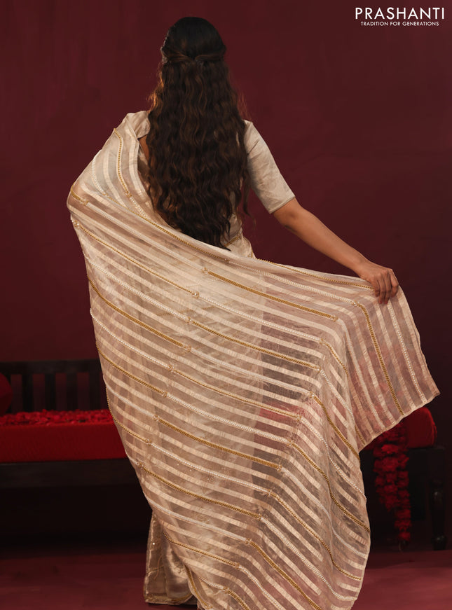 Tissue organza silk saree with allover stripes & embroidery