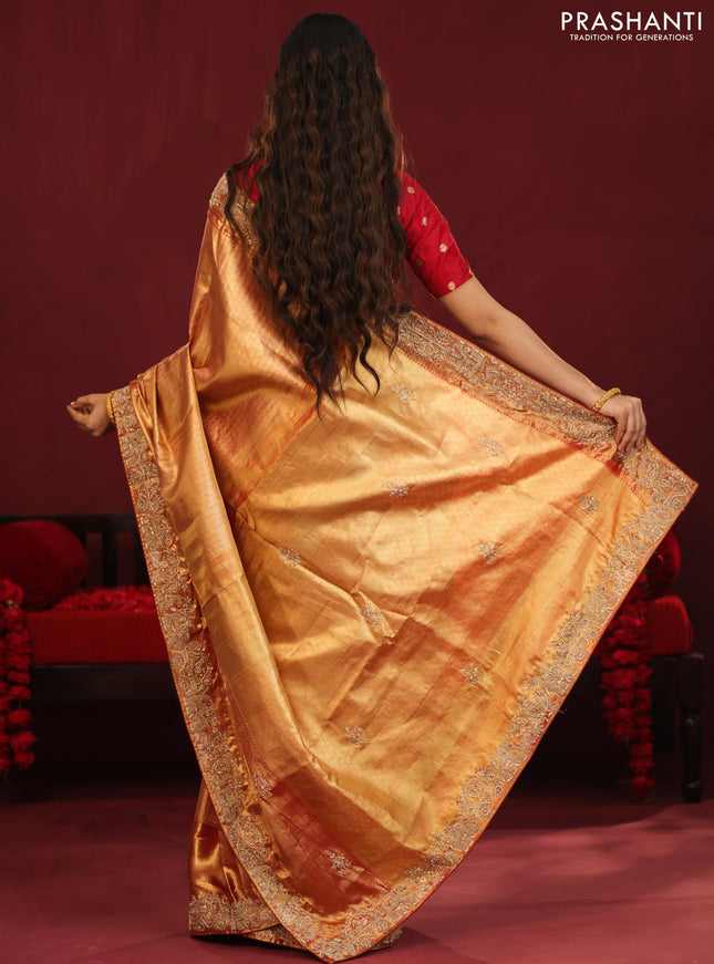 Gold & red Kanchipuram tissue Silk Saree with border Embroidery