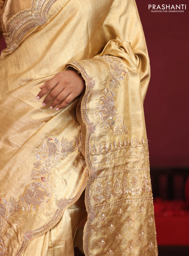 Gold pure kanchipuram tissue silk saree with embroidery border & pallu