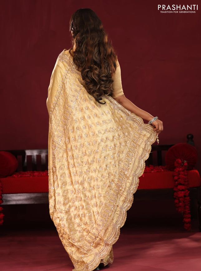 Gold pure kanchipuram tissue silk saree with embroidery border & pallu