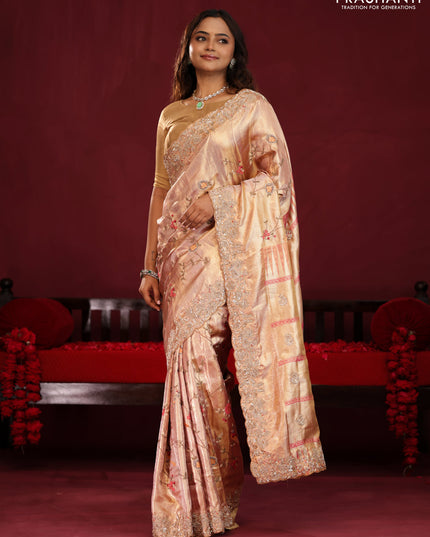 Pastel pink pure kanchipuram tissue silk saree with allover embroidery