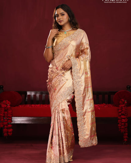 Pastel pink pure kanchipuram tissue silk saree with allover embroidery
