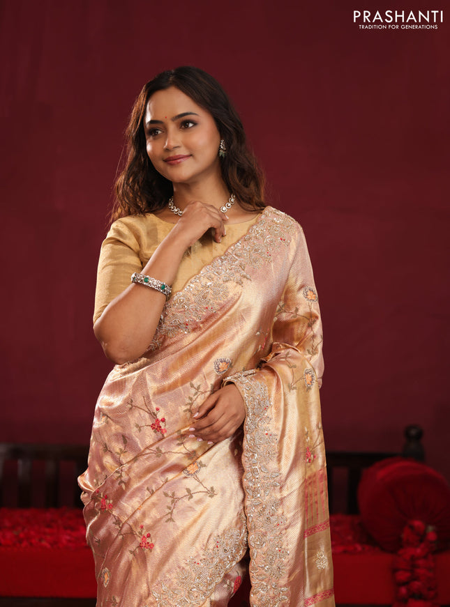 Pastel pink pure kanchipuram tissue silk saree with allover embroidery