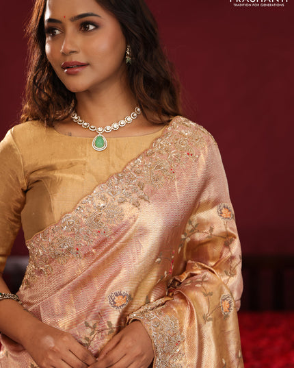 Pastel pink pure kanchipuram tissue silk saree with allover embroidery