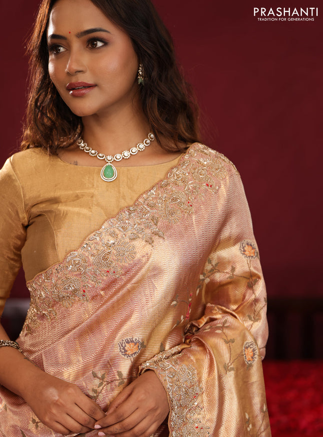 Pastel pink pure kanchipuram tissue silk saree with allover embroidery