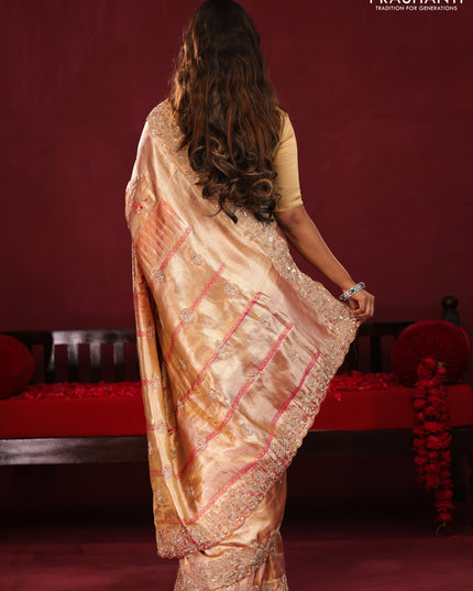 Pastel pink pure kanchipuram tissue silk saree with allover embroidery