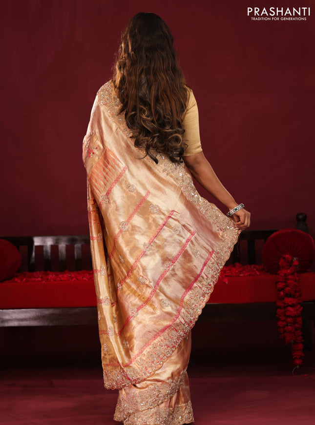 Pastel pink pure kanchipuram tissue silk saree with allover embroidery