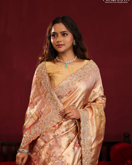 Pastel pink pure kanchipuram tissue silk saree with allover embroidery