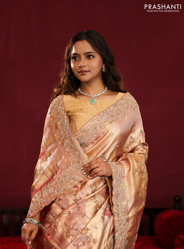 Pastel pink pure kanchipuram tissue silk saree with allover embroidery