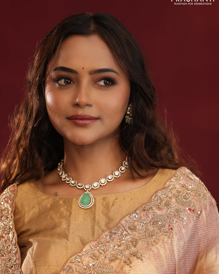 Pastel pink pure kanchipuram tissue silk saree with allover embroidery