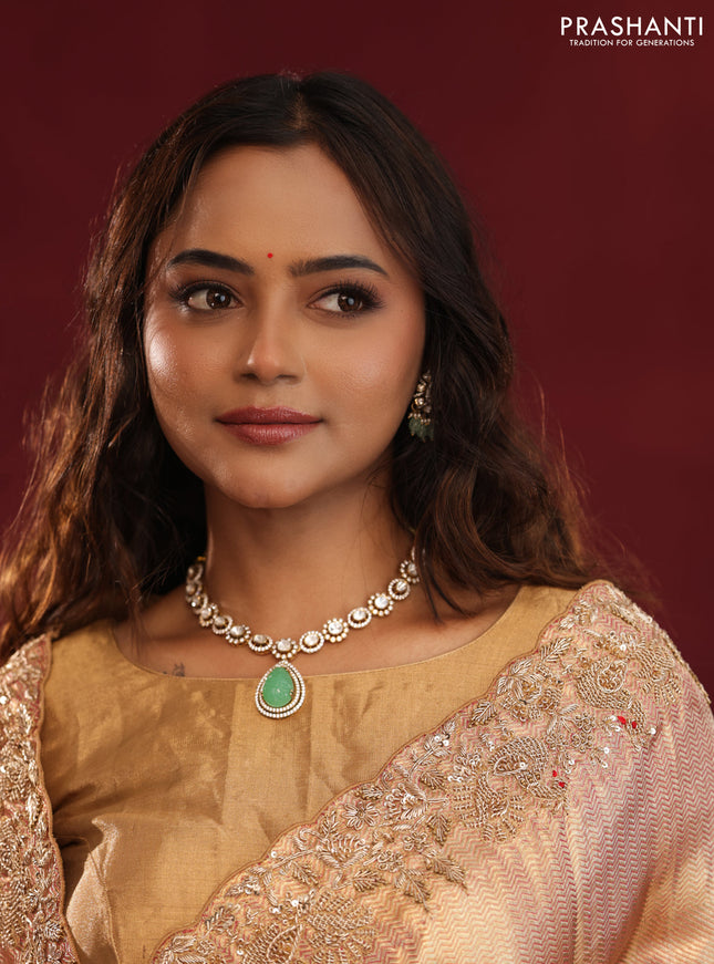 Pastel pink pure kanchipuram tissue silk saree with allover embroidery