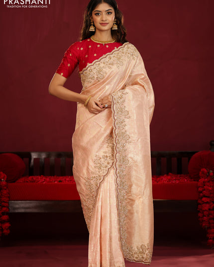 Pastel pink pure kanchipuram silk saree with allover weaves & border embroidery