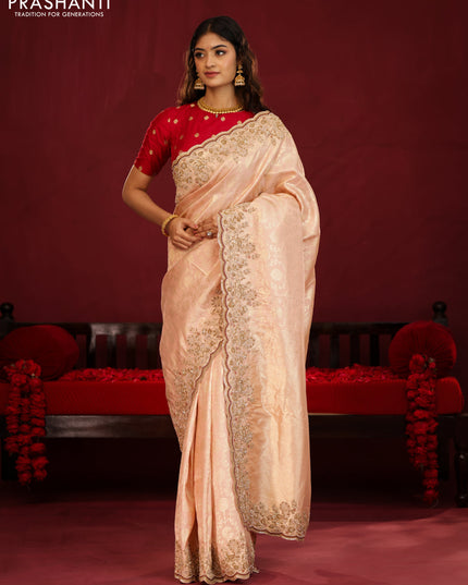 Pastel pink pure kanchipuram silk saree with allover weaves & border embroidery