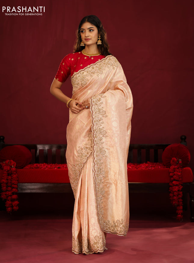 Pastel pink pure kanchipuram silk saree with allover weaves & border embroidery