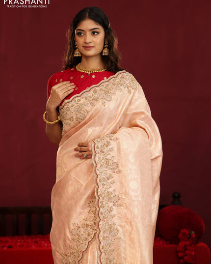 Pastel pink pure kanchipuram silk saree with allover weaves & border embroidery