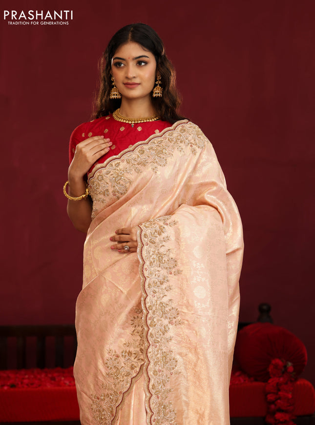 Pastel pink pure kanchipuram silk saree with allover weaves & border embroidery