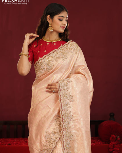 Pastel pink pure kanchipuram silk saree with allover weaves & border embroidery