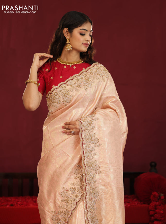Pastel pink pure kanchipuram silk saree with allover weaves & border embroidery