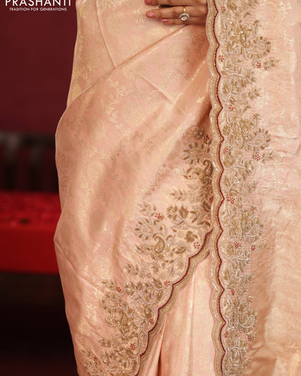 Pastel pink pure kanchipuram silk saree with allover weaves & border embroidery