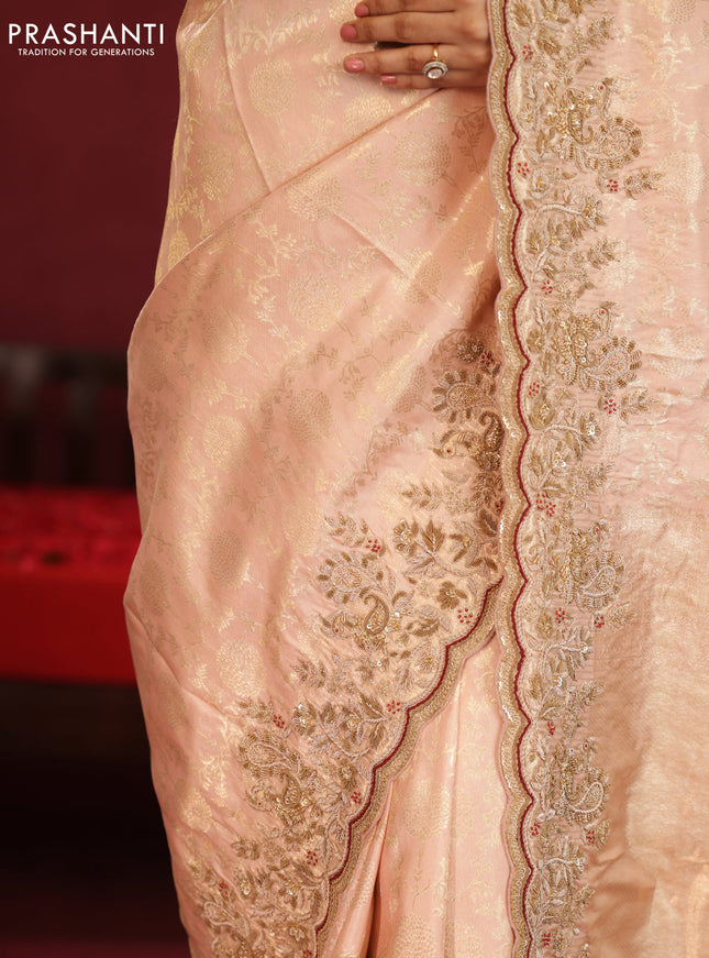 Pastel pink pure kanchipuram silk saree with allover weaves & border embroidery