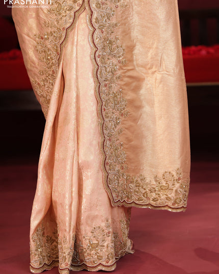 Pastel pink pure kanchipuram silk saree with allover weaves & border embroidery