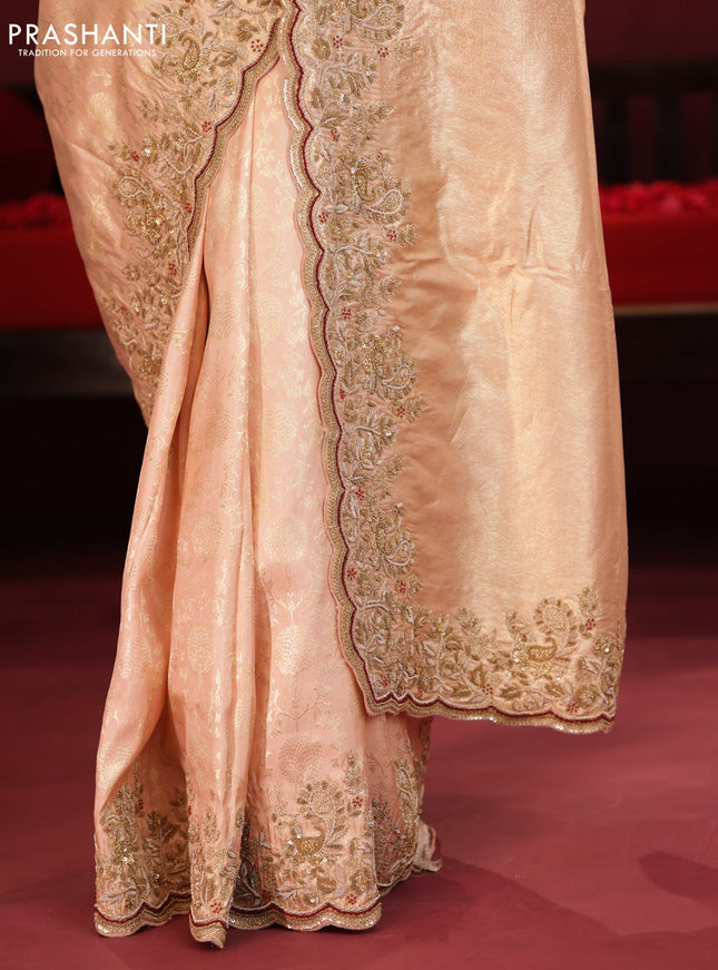 Pastel pink pure kanchipuram silk saree with allover weaves & border embroidery