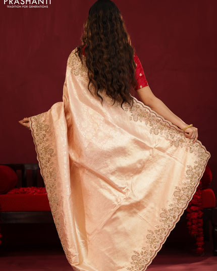 Pastel pink pure kanchipuram silk saree with allover weaves & border embroidery