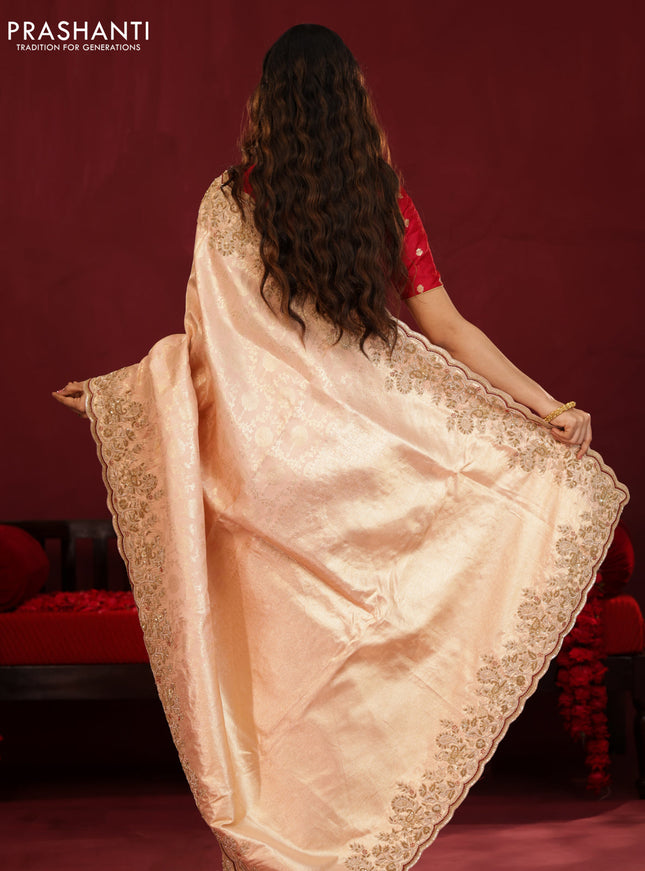 Pastel pink pure kanchipuram silk saree with allover weaves & border embroidery