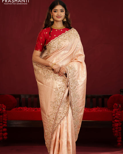 Pastel pink pure kanchipuram silk saree with allover weaves & border embroidery