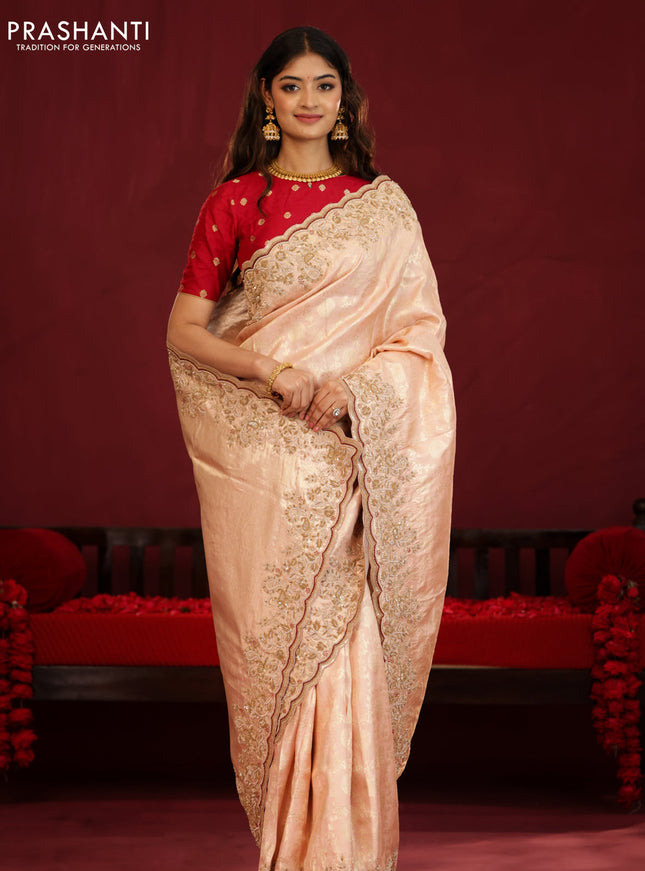 Pastel pink pure kanchipuram silk saree with allover weaves & border embroidery