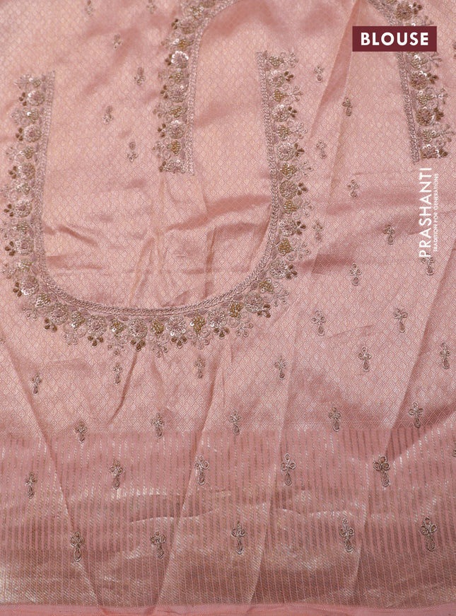 Pastel pink pure kanchipuram silk saree with allover weaves & border embroidery