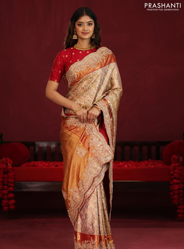 Gold & Red pure kanchipuram tissue silk saree with allover mina weaves & embroidery