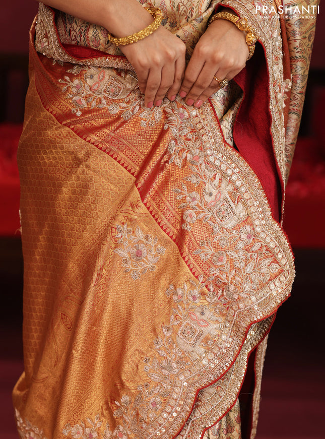 Gold & Red pure kanchipuram tissue silk saree with allover mina weaves & embroidery