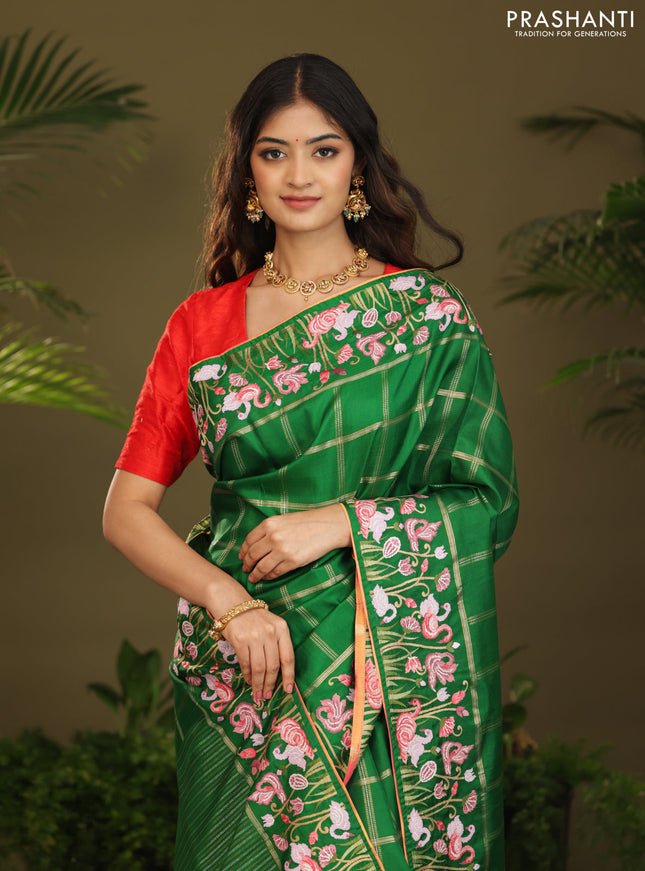Green kanchipuram silk saree with allover zari checks & border embroidery