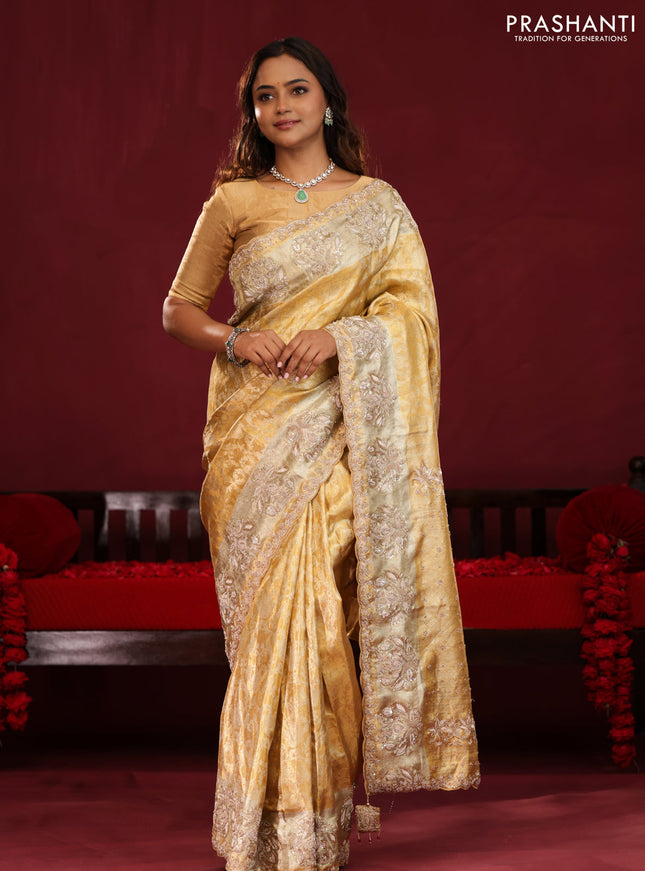 Gold Pure kanchipuram tissue silk saree with allover zari weaves & embroidery