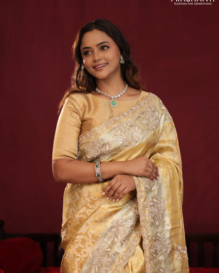 Gold Pure kanchipuram tissue silk saree with allover zari weaves & embroidery