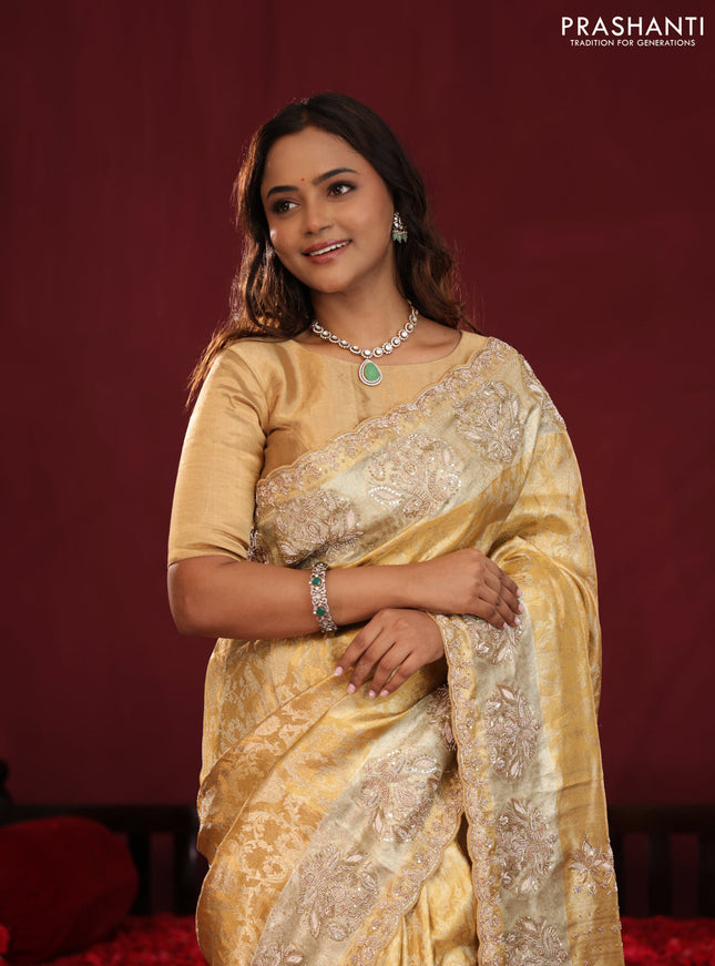 Gold Pure kanchipuram tissue silk saree with allover zari weaves & embroidery