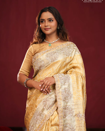 Gold Pure kanchipuram tissue silk saree with allover zari weaves & embroidery