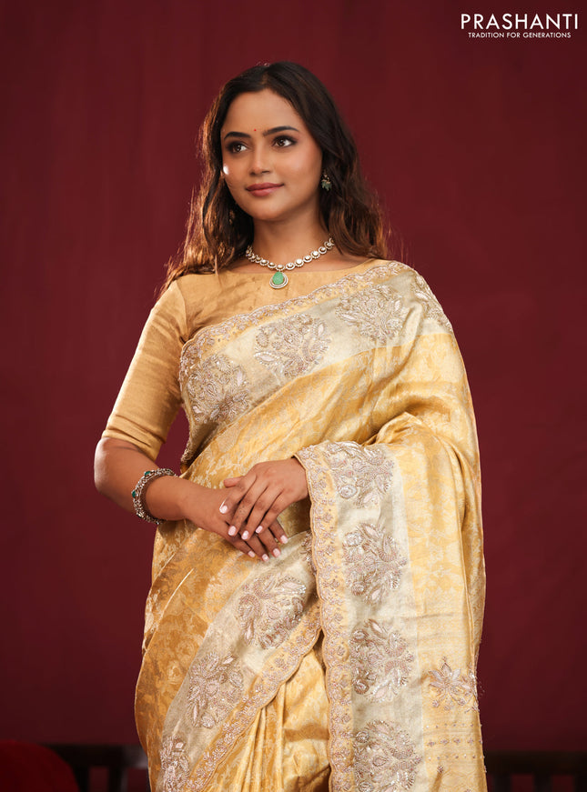 Gold Pure kanchipuram tissue silk saree with allover zari weaves & embroidery
