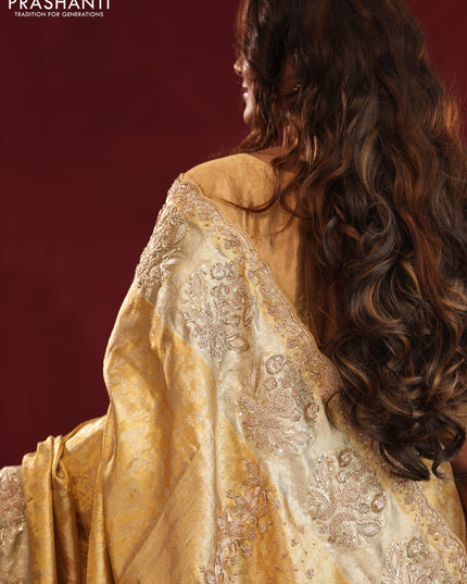 Gold Pure kanchipuram tissue silk saree with allover zari weaves & embroidery