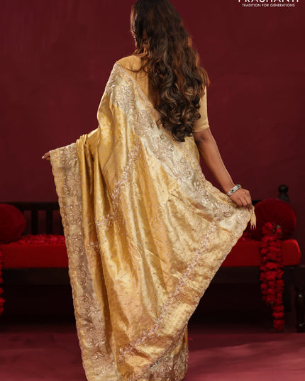 Gold Pure kanchipuram tissue silk saree with allover zari weaves & embroidery