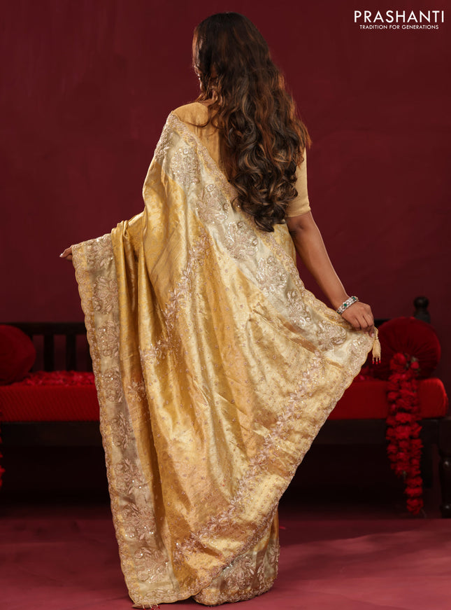 Gold Pure kanchipuram tissue silk saree with allover zari weaves & embroidery