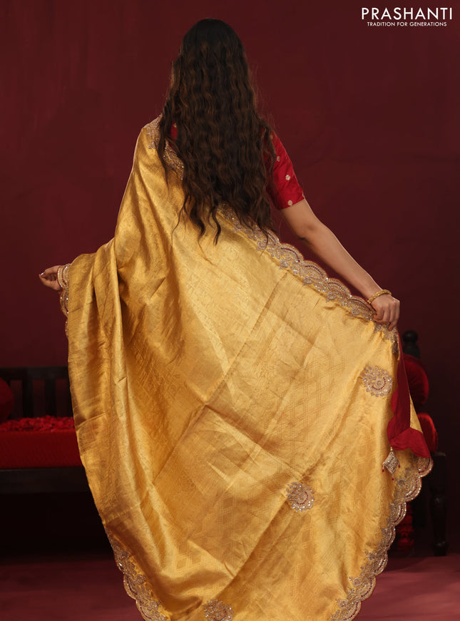 Golden tissue kanchipuram silk saree with allover brocade zari weaves & border embroidery