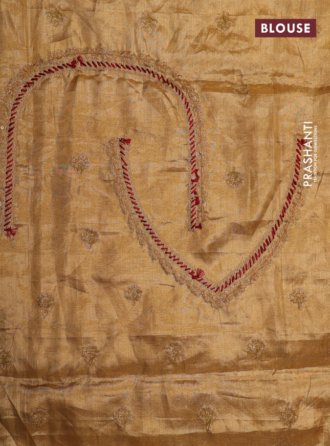 Golden tissue kanchipuram silk saree with allover brocade zari weaves & border embroidery