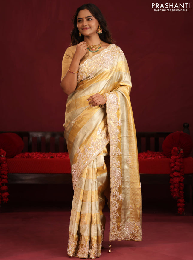 Pure tissue kanchipuram silk saree with allover zari weaves & border embroidery