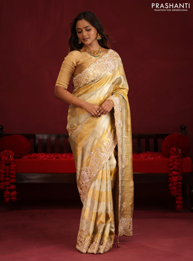 Pure tissue kanchipuram silk saree with allover zari weaves & border embroidery