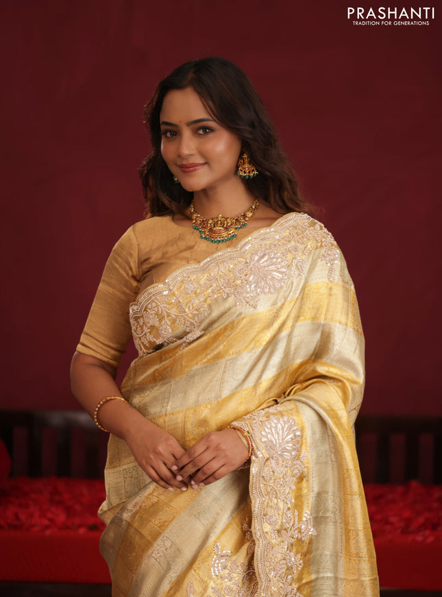 Pure tissue kanchipuram silk saree with allover zari weaves & border embroidery