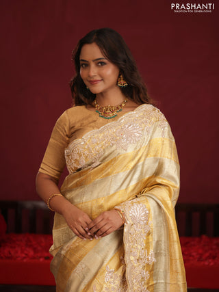 Pure tissue kanchipuram silk saree with allover zari weaves & border embroidery